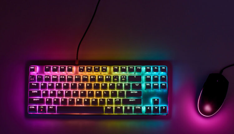 Gaming keyboard with RGB light. White mechanical keyboard and mo